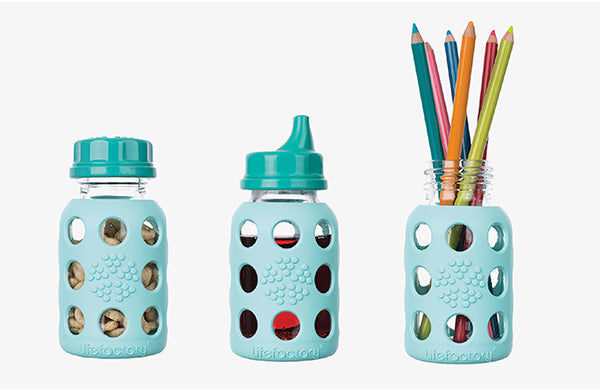 Multiple uses for glass baby bottles including to hold snack with flat cap, for drink with sippy lid, and a holder for colored pencils without lid.