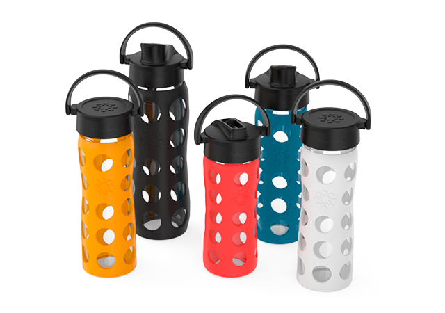 Assortment of Lifefactory glass water bottles with an assortment of caps.