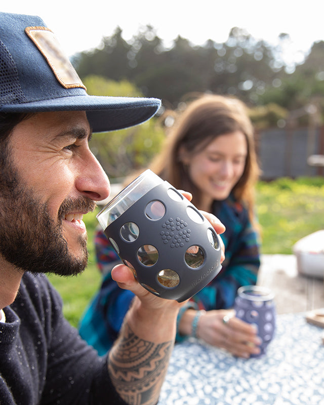 People at a picnic, drinking from Lifefactory stemless wine glasses.