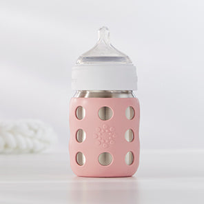 Lifefactory stainless steel baby bottle with silicone nipple.