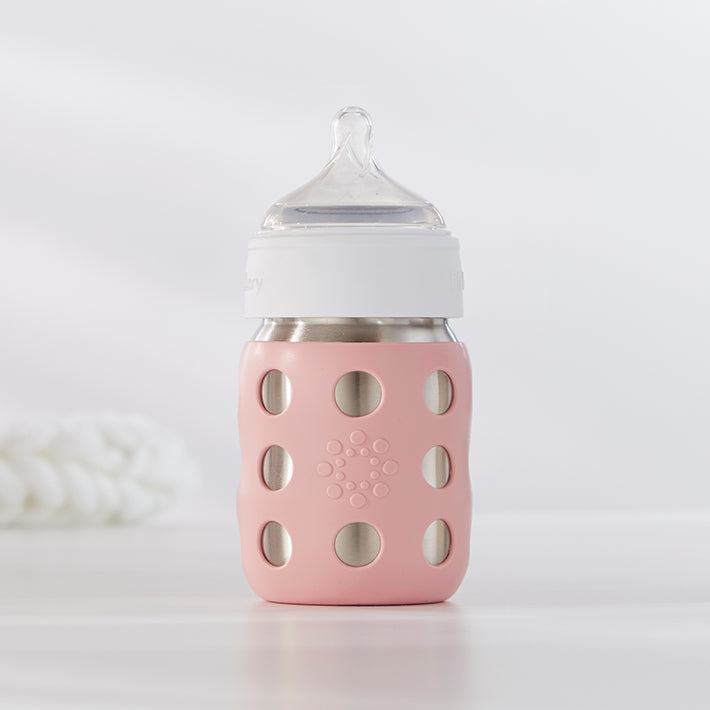 Lifefactory stainless steel baby bottle with silicone nipple.